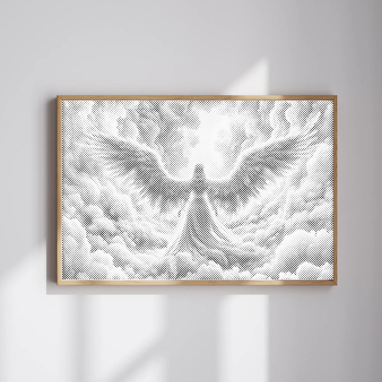Framed Dot Painting artwork of an angel on a white wall