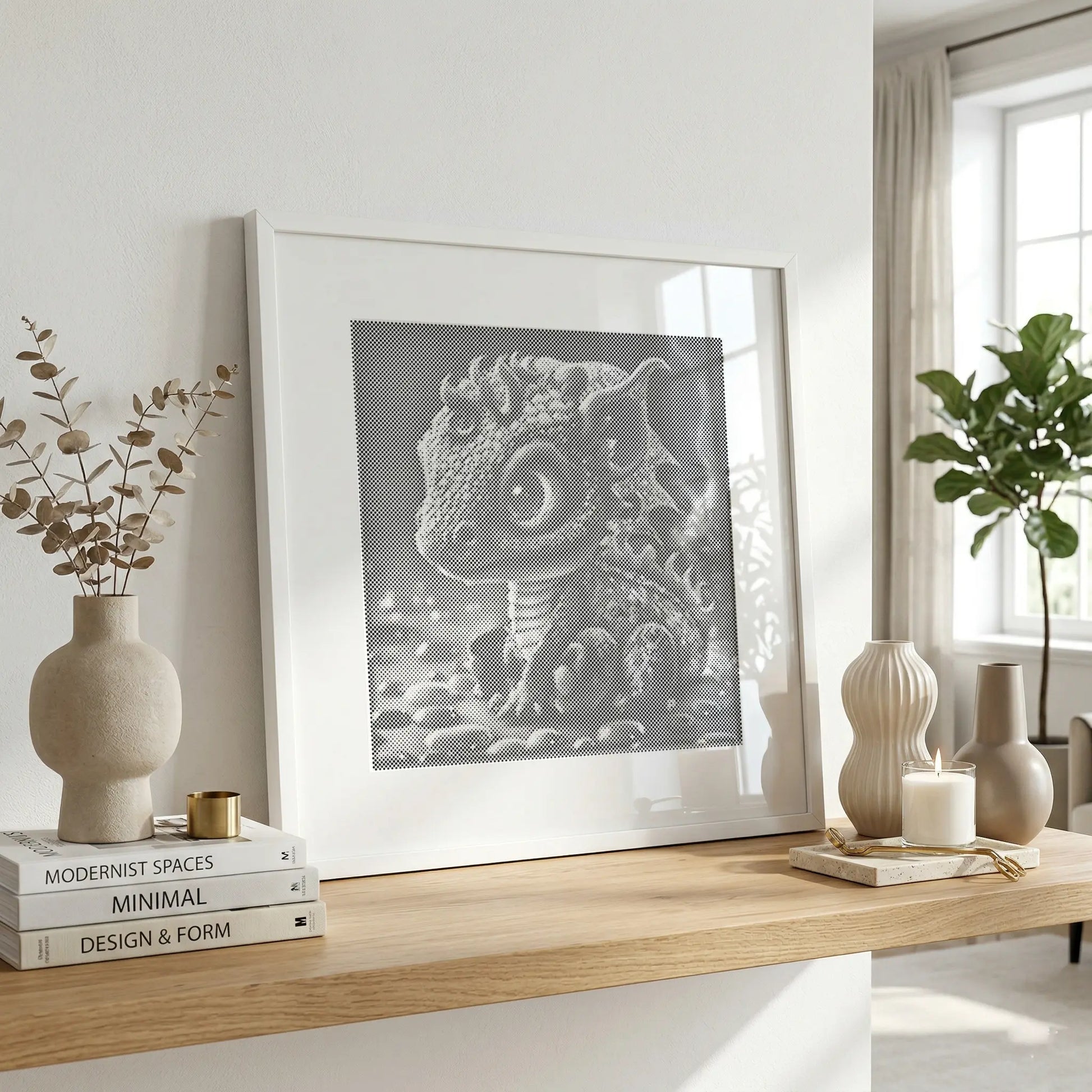 Framed artwork of a dragon on a wooden shelf with decor items in a bright room. Baby Dragon | Dot Painting Kit