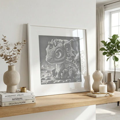 Framed artwork of a dragon on a wooden shelf with decor items in a bright room. Baby Dragon | Dot Painting Kit