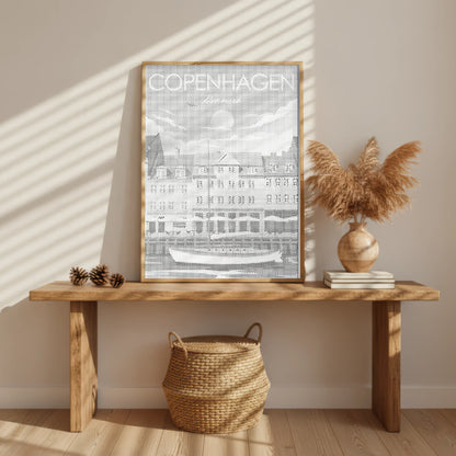 Framed Copenhagen poster on a wooden table with decorative items. Copenhagen Nyhavn | Dot Painting Kit