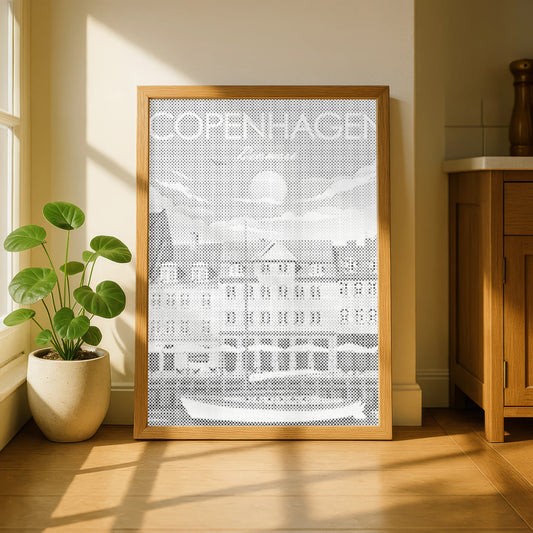 Framed artwork with 'COPENHAGEN' text in a room with a plant and wooden cabinet. Copenhagen Nyhavn | Dot Painting Kit