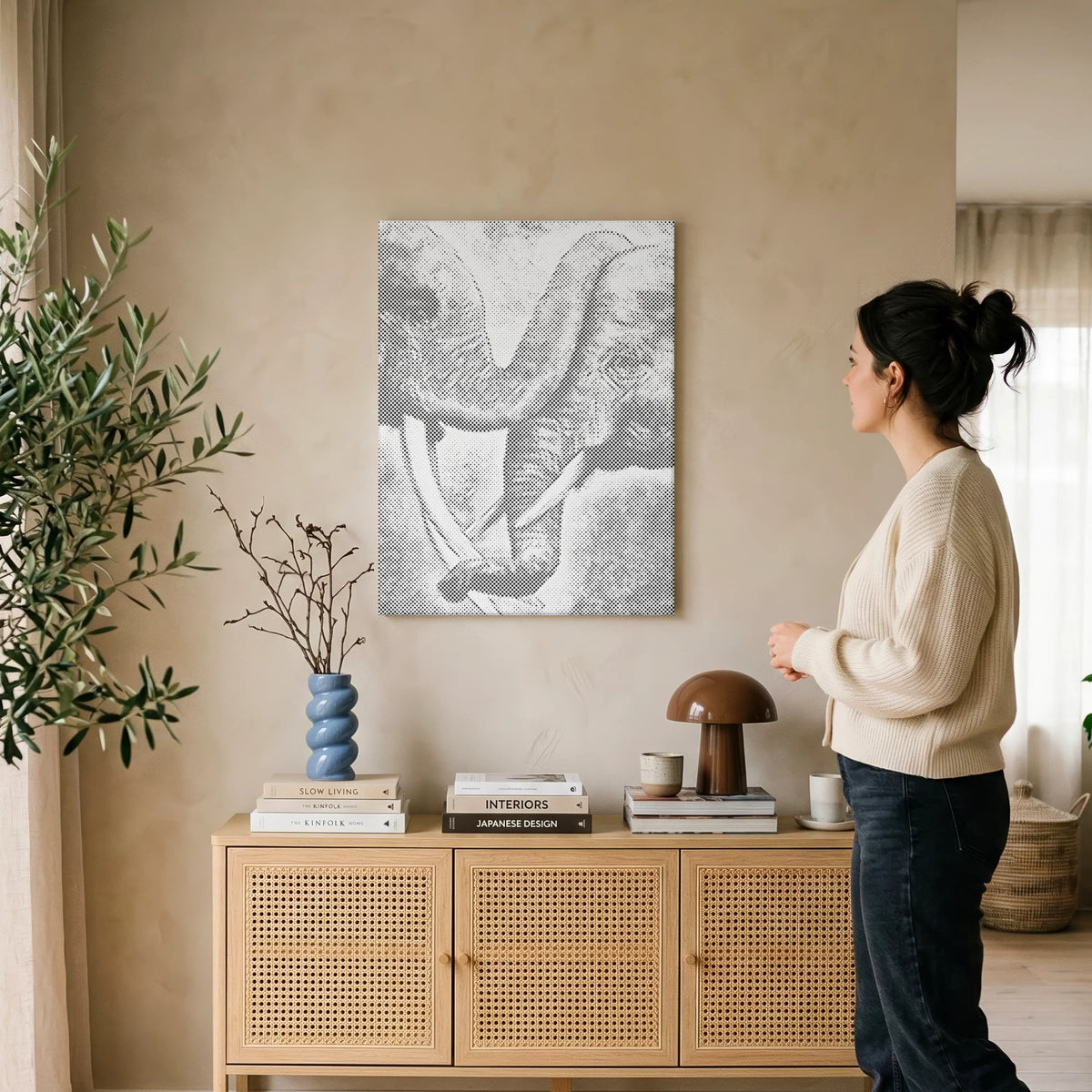Finished dot painting artwork displayed in a calm interior