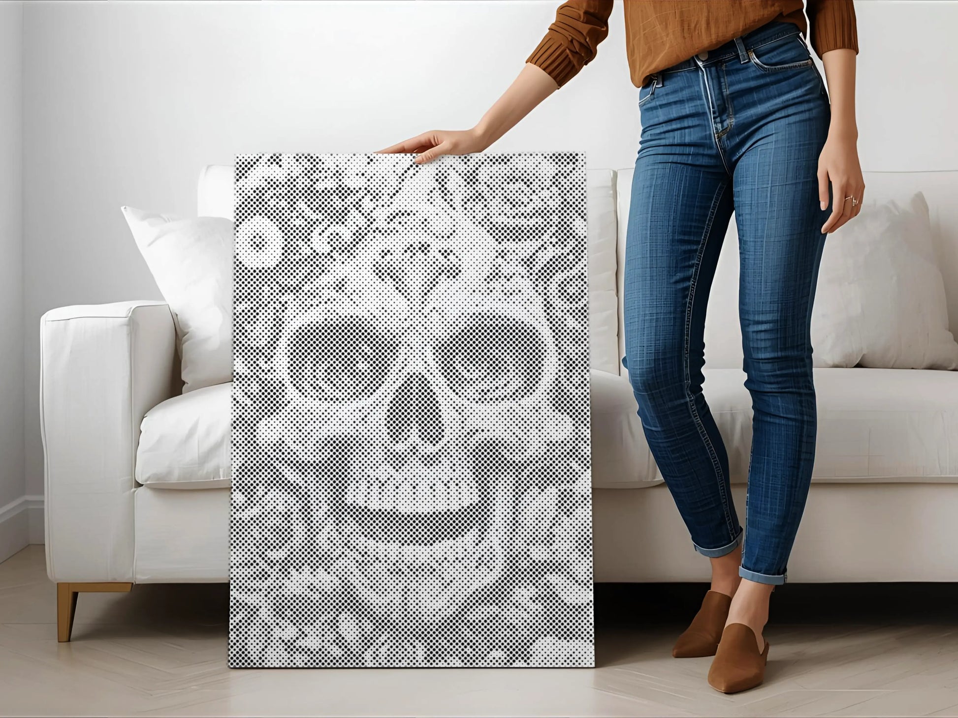 Person holding a decorative panel with a skull design in a living room. Floral Skull | Dot Painting Kit