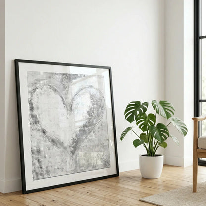 Framed paint dy dots dot painting on a wall with a plant in the foreground