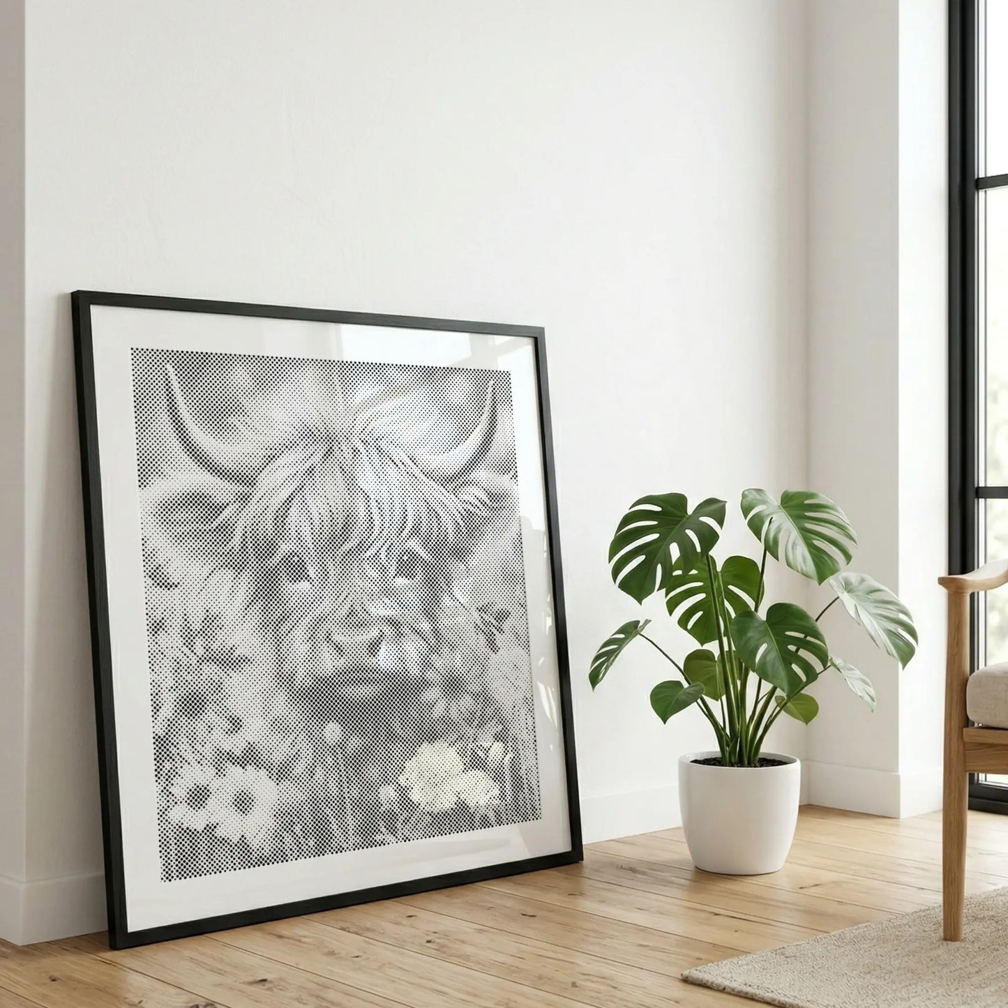 Framed artwork of a highland cow in a room with a plant and chair.