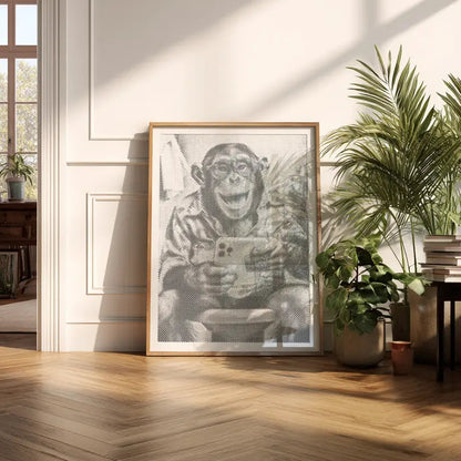 Framed artwork of a monkey holding a camera in a sunlit room with plants and books.