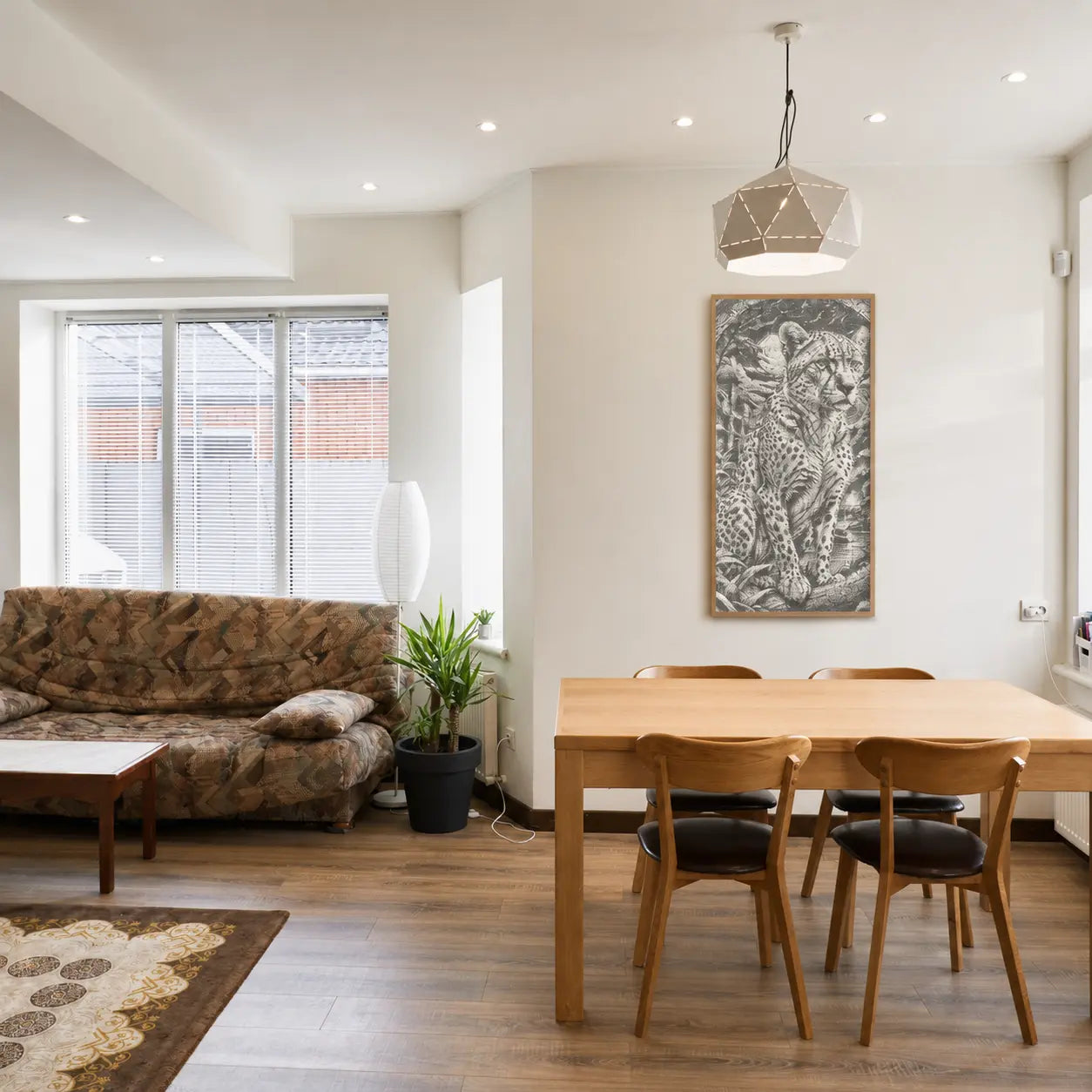 Modern living room with a dining table and chairs, featuring a wall art of a tiger. Majestic Leopard | Dot Painting Kit