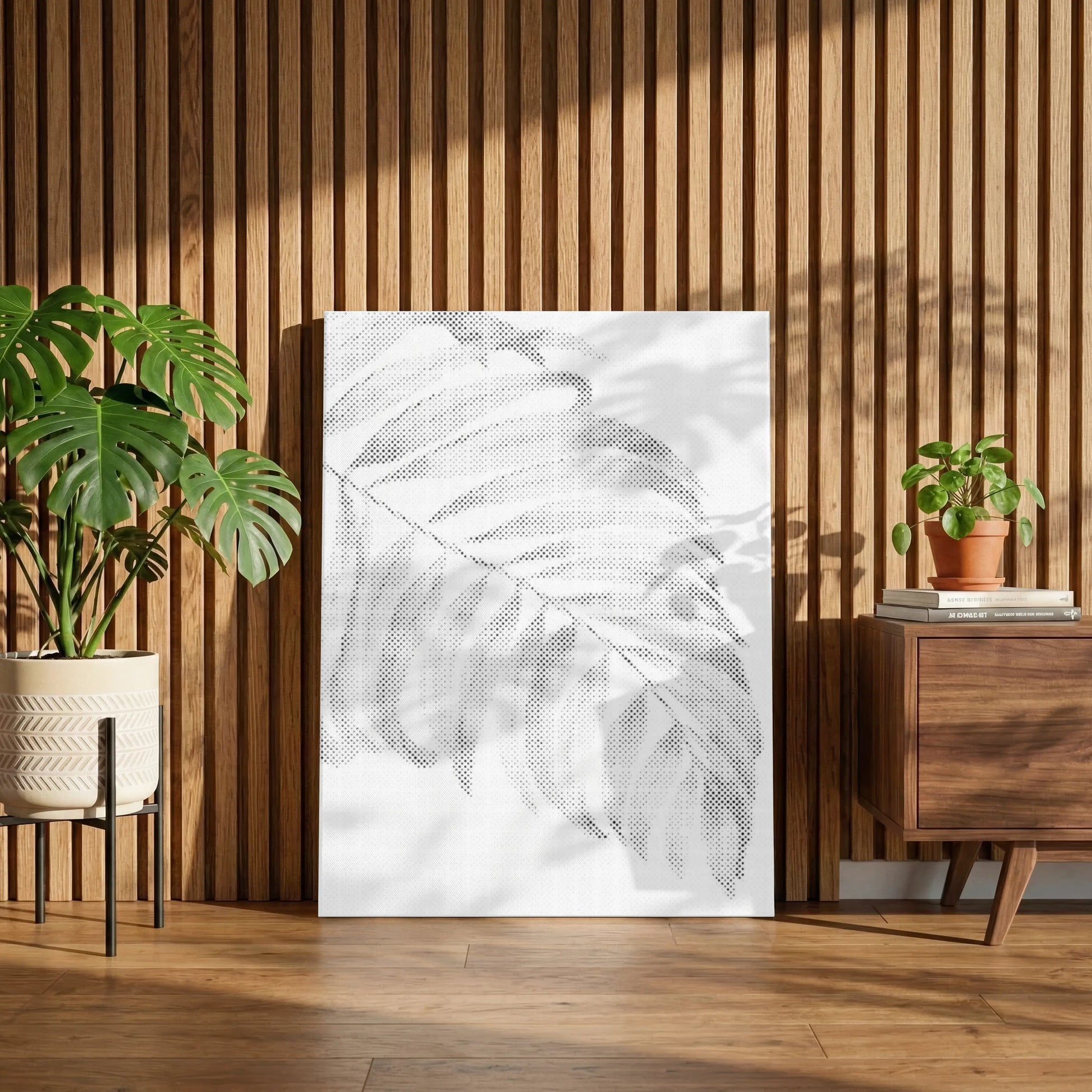 Framed artwork of a leaf on a wooden wall with plants and a dresser. Palm Leaf Minimalist | Dot Painting Kit
