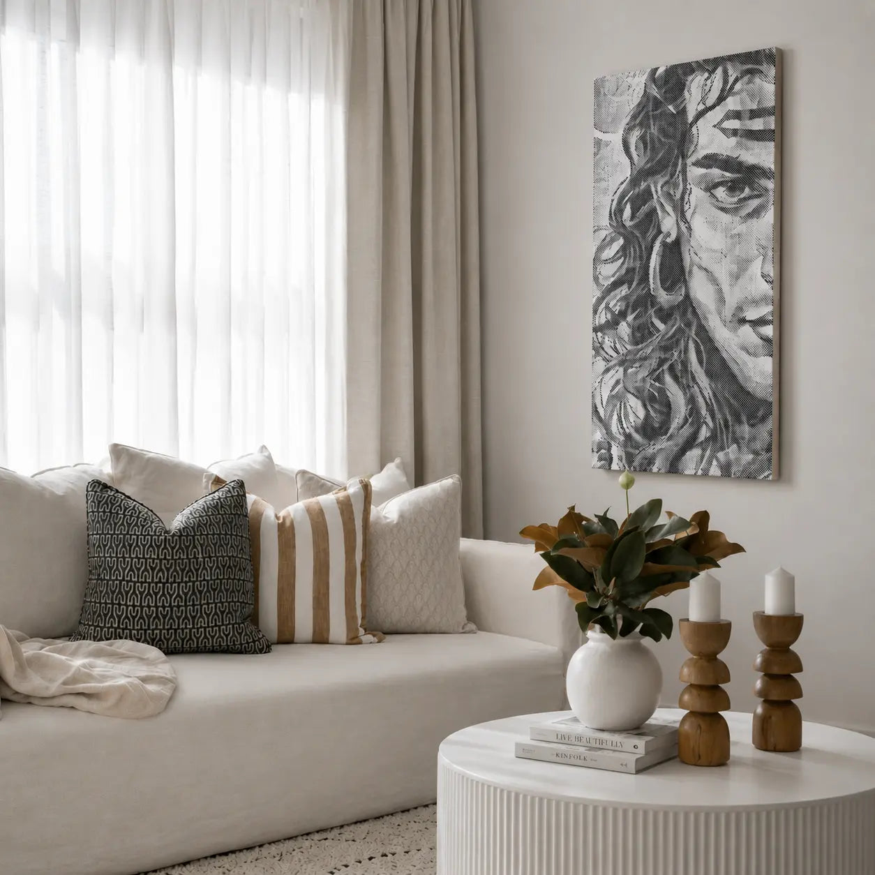 Living room with a beige sofa, decorative pillows, a round coffee table with candles and a vase, and a wall art piece. Shiva Hindu God | Dot Painting Kit