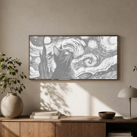 Framed artwork of a cat with a starry night design above a wooden cabinet.