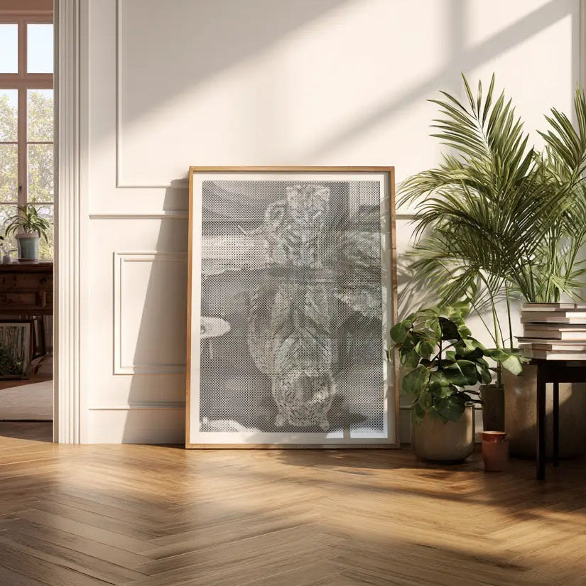 Framed artwork on a wall in a sunlit room with plants Dot Painting Tiger 