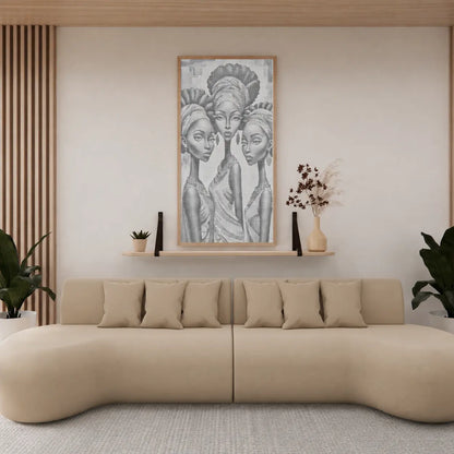 Beige sofa in a living room with a wall art piece above it. Three African Women | Dot Painting Kit