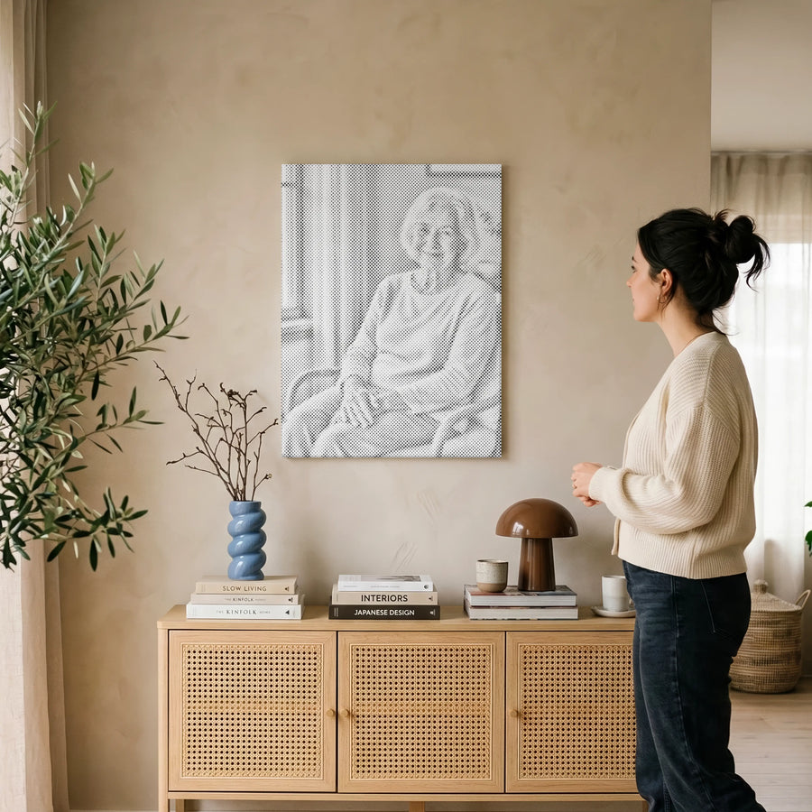 A person placing dots on a Paint By Dots canvas in our European studio